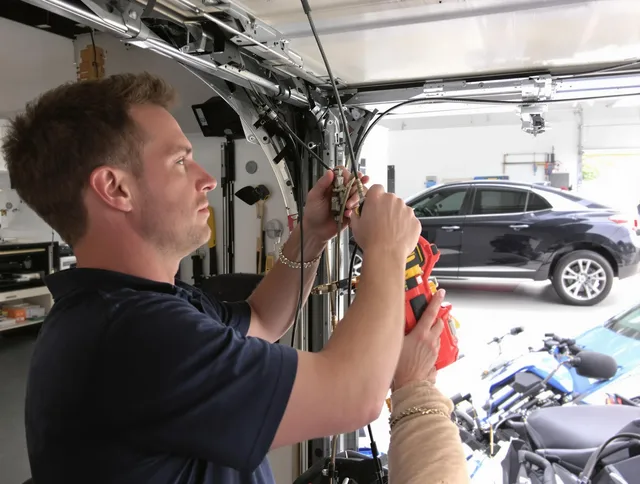 Riverview Garage Door Repair safety certified technician performing cable replacement in Riverview