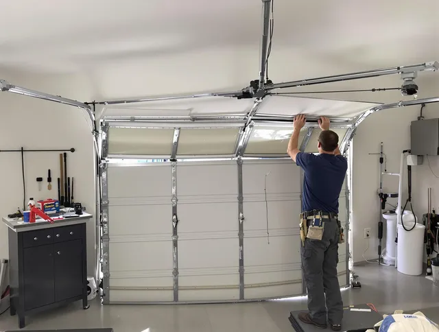 Riverview Garage Door Repair specialist performing precise section replacement on Riverview garage door