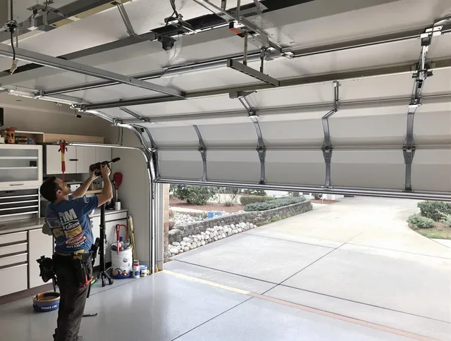 Garage door track repair service by Riverview Garage Door Repair in Riverview